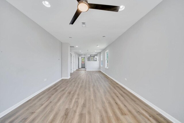 14631 Vincennes Rd, Harvey, IL 60426 - unfurnished living room featuring ceiling fan, light wood-style floors, baseboards, and recessed lighting