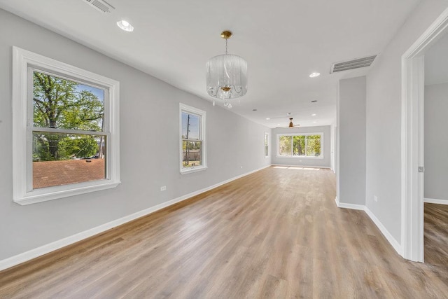 14631 Vincennes Rd, Harvey, IL 60426 - unfurnished living room featuring a chandelier, light wood finished floors, baseboards, and recessed lighting