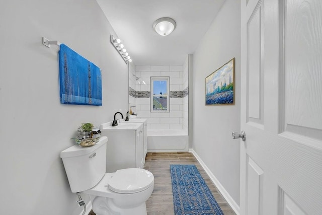 14631 Vincennes Rd, Harvey, IL 60426 - full bathroom featuring toilet, wood finished floors, baseboards, vanity, and shower / washtub combination