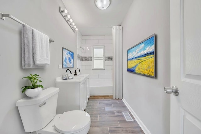 14631 Vincennes Rd, Harvey, IL 60426 - full bathroom with toilet, shower / bath combination with curtain, vanity, baseboards, and wood finished floors