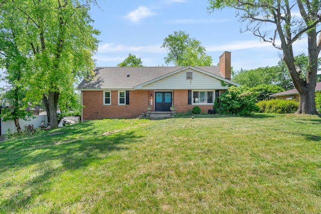 22614 S Joseph Ave, Channahon, IL 60410 - view of front of house with brick siding, a front lawn, and a chimney
