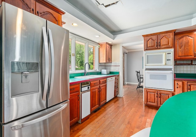 22614 S Joseph Ave, Channahon, IL 60410 - kitchen with white appliances, backsplash, light wood finished floors, recessed lighting, and brown cabinets