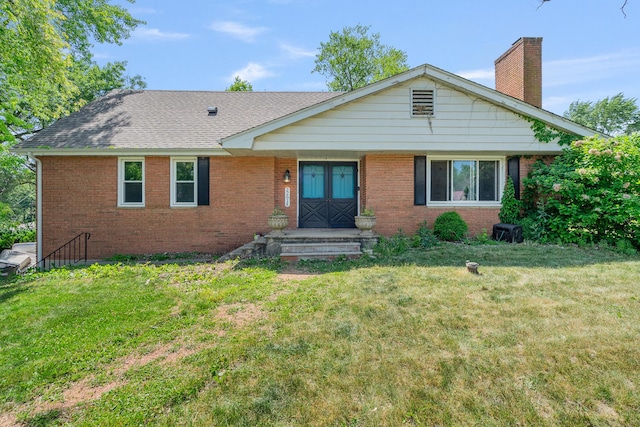 22614 S Joseph Ave, Channahon, IL 60410 - ranch-style home with a chimney, brick siding, a front lawn, and a shingled roof