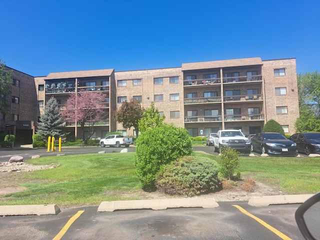 1400 N Elmhurst Rd Unit 106, Mount Prospect, IL 60056 - view of apartment building / complex with uncovered parking
