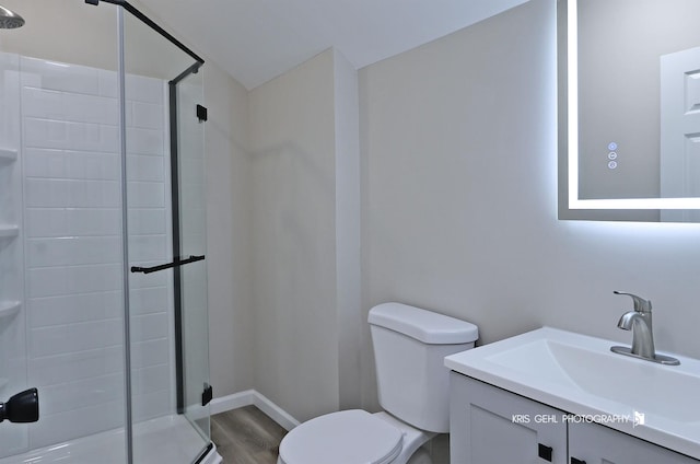 1401 N Park Dr, Round Lake Beach, IL 60073 - bathroom featuring a stall shower, toilet, and wood finished floors