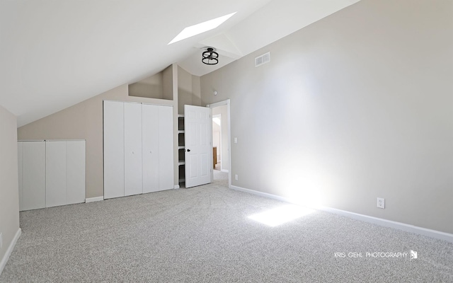 1401 N Park Dr, Round Lake Beach, IL 60073 - additional living space featuring a skylight, carpet, baseboards, and high vaulted ceiling