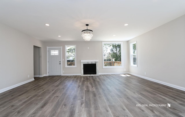 1401 N Park Dr, Round Lake Beach, IL 60073 - unfurnished living room with wood finished floors, baseboards, a fireplace, a chandelier, and recessed lighting