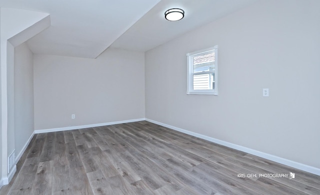 1401 N Park Dr, Round Lake Beach, IL 60073 - additional living space featuring wood finished floors and baseboards