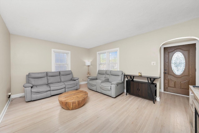 17819 Walter St, Lansing, IL 60438 - living room with light wood-style floors, arched walkways, and baseboards