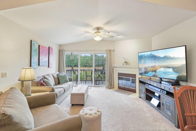 8421 Canary Grass Ln Unit 8421, Fox Lake, IL 60020 - carpeted living room featuring ceiling fan, a tile fireplace, and vaulted ceiling