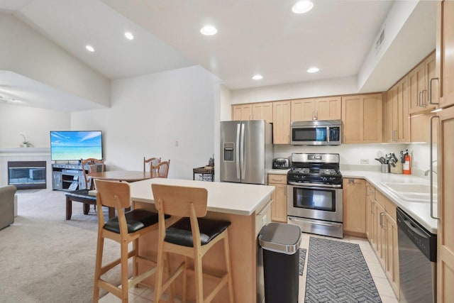 8421 Canary Grass Ln Unit 8421, Fox Lake, IL 60020 - kitchen with appliances with stainless steel finishes, light brown cabinetry, open floor plan, a kitchen island, and recessed lighting