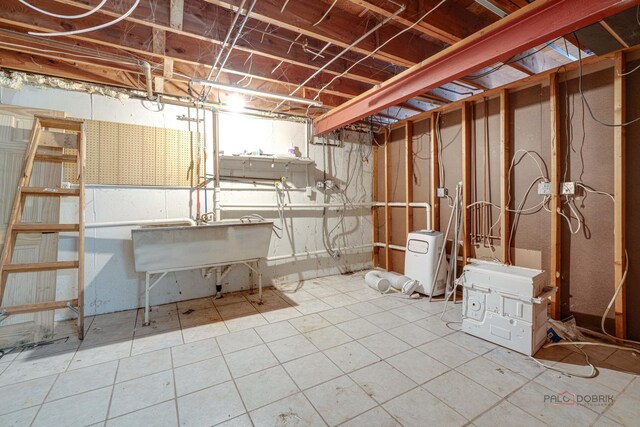 unfinished basement with a sink
