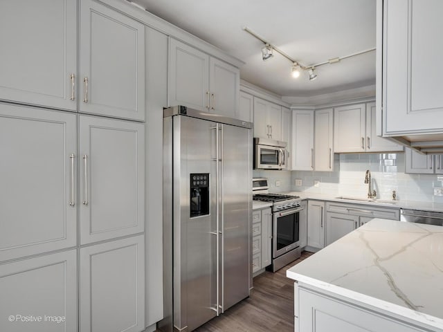 720 W Randolph St Unit 907, Chicago, IL 60661 - kitchen featuring stainless steel appliances, a sink, tasteful backsplash, and light stone countertops