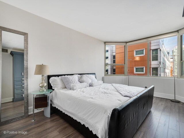 720 W Randolph St Unit 907, Chicago, IL 60661 - bedroom featuring wood finished floors and baseboards