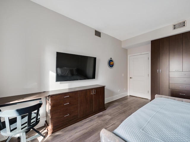 720 W Randolph St Unit 907, Chicago, IL 60661 - bedroom featuring wood finished floors and baseboards