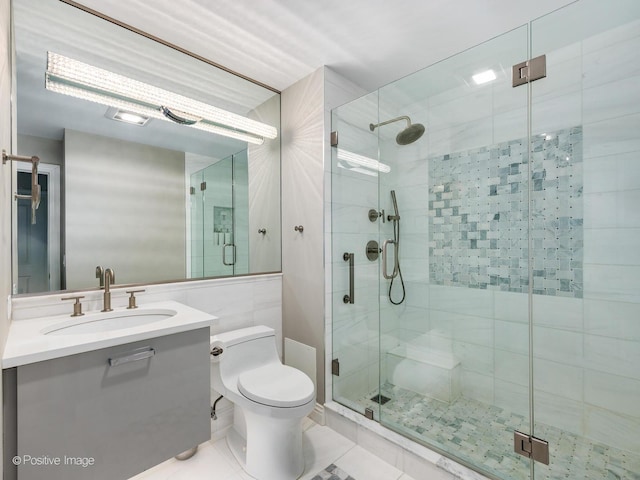 720 W Randolph St Unit 907, Chicago, IL 60661 - bathroom featuring a stall shower, vanity, toilet, and tile patterned floors