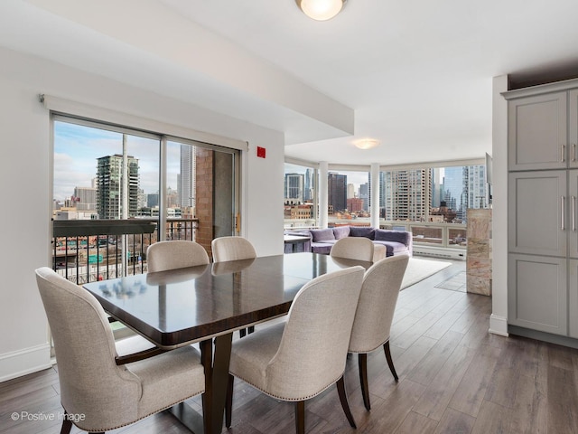 720 W Randolph St Unit 907, Chicago, IL 60661 - dining area with a city view, wood finished floors, and baseboards