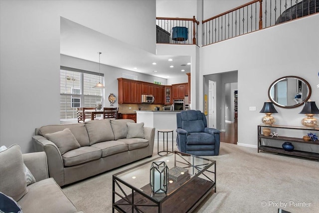 3879 Seigle Dr, Elgin, IL 60124 - living area with light colored carpet, a high ceiling, and baseboards