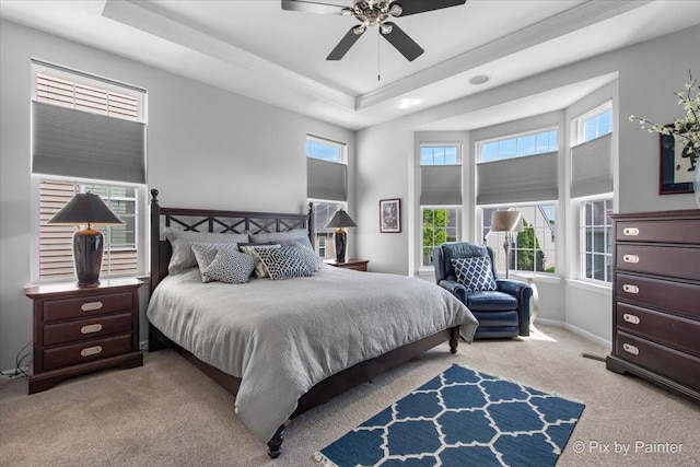 3879 Seigle Dr, Elgin, IL 60124 - carpeted bedroom featuring a raised ceiling, ornamental molding, baseboards, and a ceiling fan