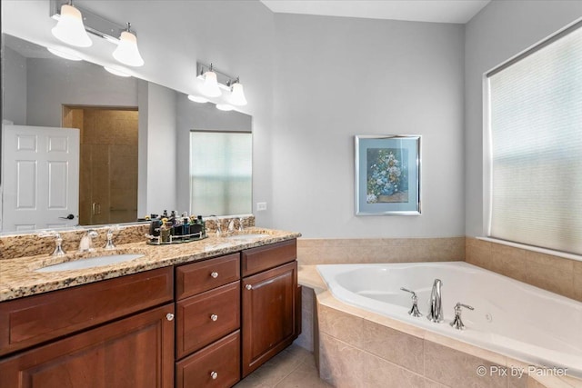3879 Seigle Dr, Elgin, IL 60124 - bathroom featuring double vanity, a bath, and tile patterned flooring