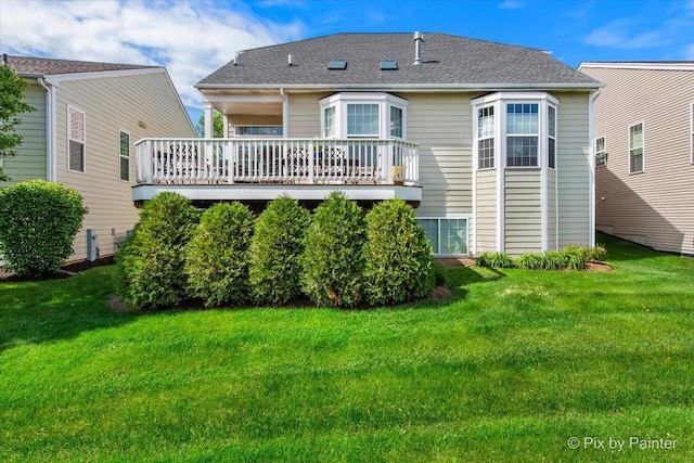 3879 Seigle Dr, Elgin, IL 60124 - rear view of house with a deck, a lawn, and roof with shingles