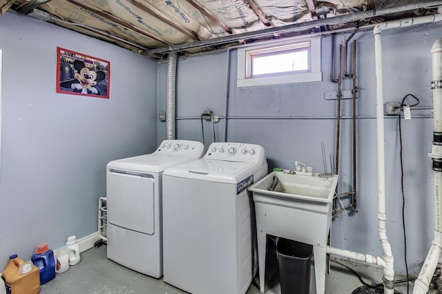 laundry area with washing machine and clothes dryer