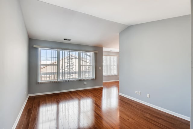 1125 N Red Oak Cir Unit 3, Round Lake Beach, IL 60073 - unfurnished room featuring wood finished floors and baseboards