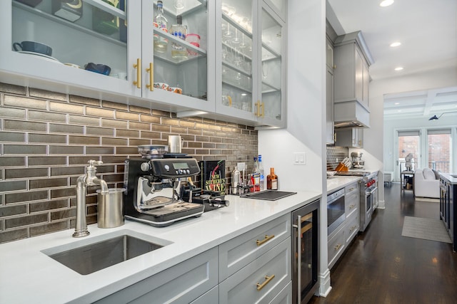 1616 N Winchester Ave, Chicago, IL 60622 - bar featuring a sink, backsplash, stainless steel appliances, recessed lighting, and dark wood finished floors