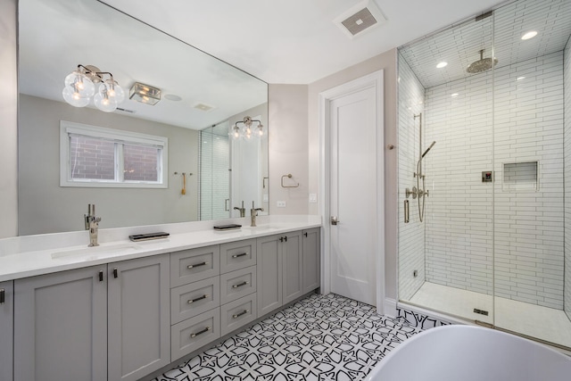 1616 N Winchester Ave, Chicago, IL 60622 - bathroom featuring a shower stall, double vanity, a soaking tub, and recessed lighting