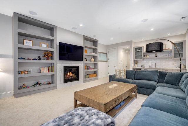 1616 N Winchester Ave, Chicago, IL 60622 - living room featuring light colored carpet, baseboards, a high end fireplace, built in shelves, and recessed lighting