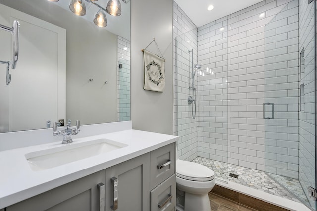 1616 N Winchester Ave, Chicago, IL 60622 - bathroom with a shower stall, toilet, wood finished floors, vanity, and recessed lighting