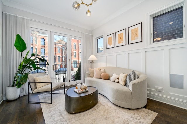1616 N Winchester Ave, Chicago, IL 60622 - living area with a decorative wall, dark wood-style floors, wainscoting, baseboards, and crown molding