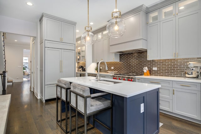 1616 N Winchester Ave, Chicago, IL 60622 - kitchen with a sink, decorative backsplash, light countertops, an island with sink, and recessed lighting