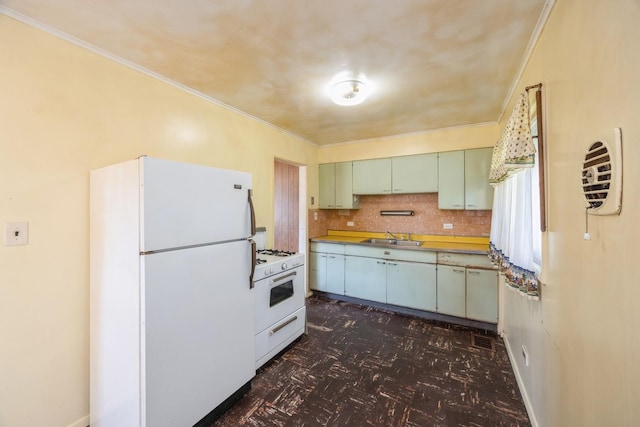 6131 S Brainard Ave, Countryside, IL 60525 - kitchen with white appliances, a sink, green cabinetry, crown molding, and tasteful backsplash