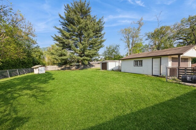 6131 S Brainard Ave, Countryside, IL 60525 - view of yard with a storage unit and an outbuilding