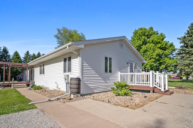 475 E Clay St, El Paso, IL 61738 - view of home's exterior featuring a wooden deck, a pergola, and a patio area
