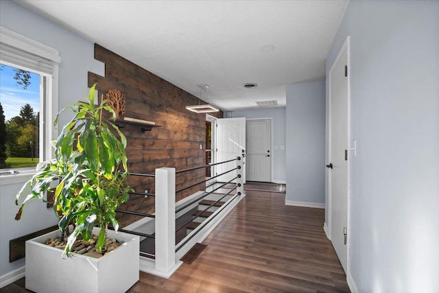 475 E Clay St, El Paso, IL 61738 - hall featuring baseboards, wood finished floors, and stairway