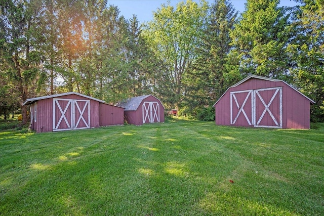 475 E Clay St, El Paso, IL 61738 - view of grassy yard with a storage unit and an outdoor structure