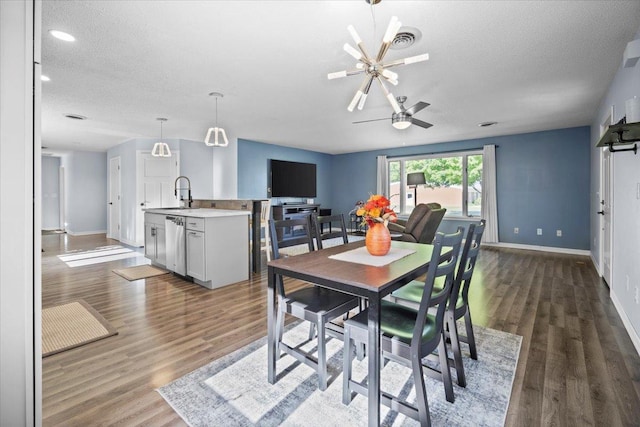 475 E Clay St, El Paso, IL 61738 - dining space featuring baseboards, wood finished floors, a ceiling fan, a textured ceiling, and recessed lighting