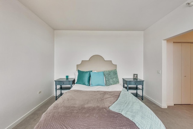 carpeted bedroom with baseboards