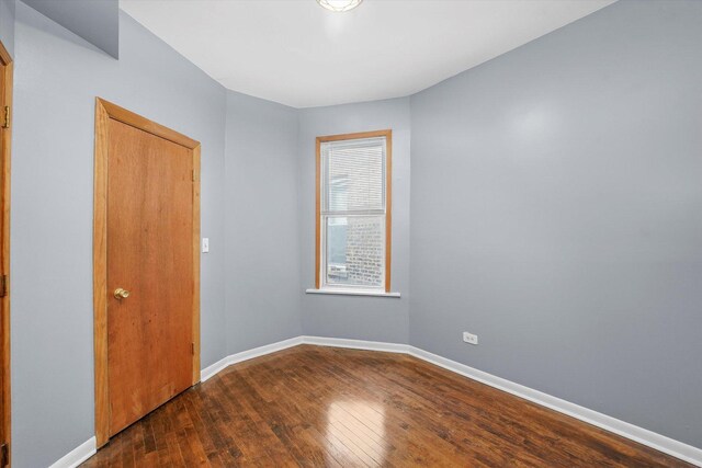 1238 S Harding Ave, Chicago, IL 60623 - unfurnished room with wood finished floors and baseboards