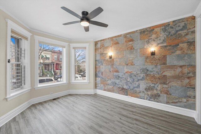 1238 S Harding Ave, Chicago, IL 60623 - spare room with wood finished floors, baseboards, ceiling fan, and ornamental molding