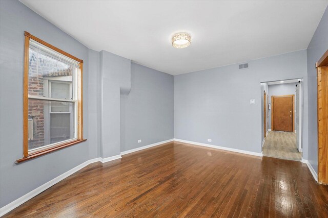 1238 S Harding Ave, Chicago, IL 60623 - unfurnished room with hardwood / wood-style flooring and baseboards