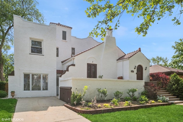 1009 S Delphia Ave, Park Ridge, IL 60068 - mediterranean / spanish-style home with stucco siding and a tiled roof