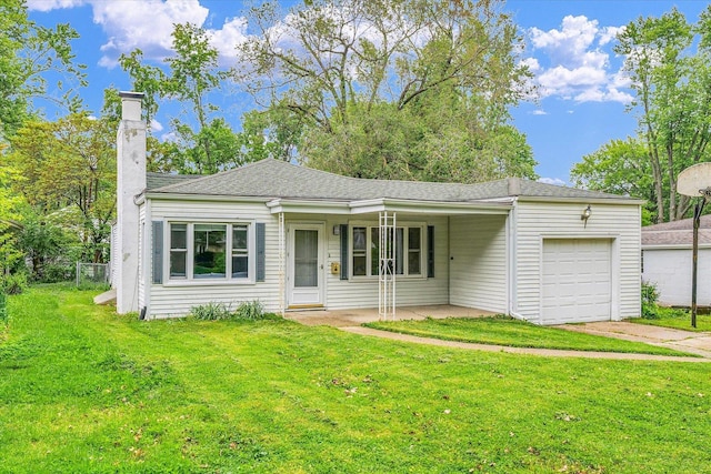 608 Hessel Blvd, Champaign, IL 61820 - view of front of house featuring a garage, a front lawn, a chimney, and driveway