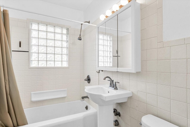 608 Hessel Blvd, Champaign, IL 61820 - full bath featuring tile walls, shower / tub combo with curtain, toilet, healthy amount of natural light, and decorative backsplash