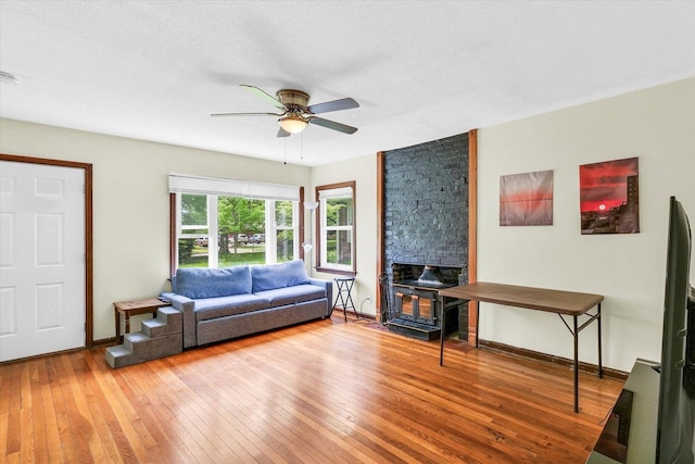 608 Hessel Blvd, Champaign, IL 61820 - living room featuring hardwood / wood-style flooring, a ceiling fan, baseboards, and a textured ceiling