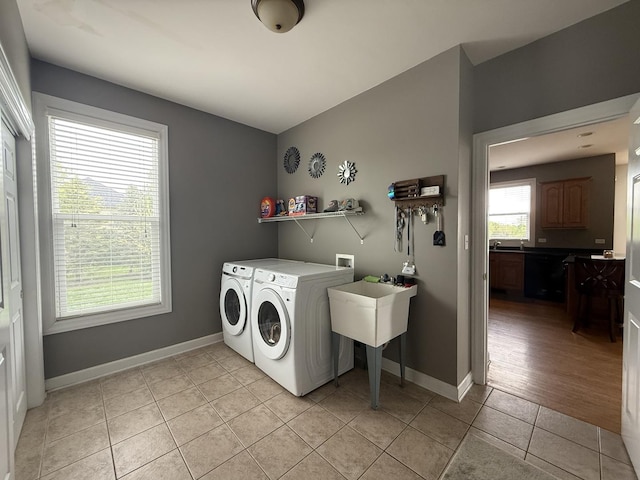 43W465 Otter Ln, Saint Charles, IL 60175 - laundry area with washing machine and clothes dryer, light tile patterned floors, and baseboards