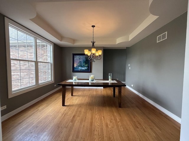 43W465 Otter Ln, Saint Charles, IL 60175 - home office with a tray ceiling, baseboards, and wood finished floors