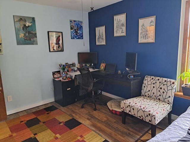 office area with wood finished floors and baseboards